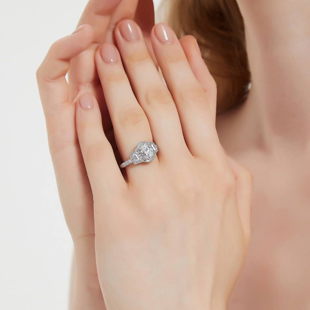 Model wearing 3-Stone Halo Oval CZ Ring in Sterling Silver, 6 of 11