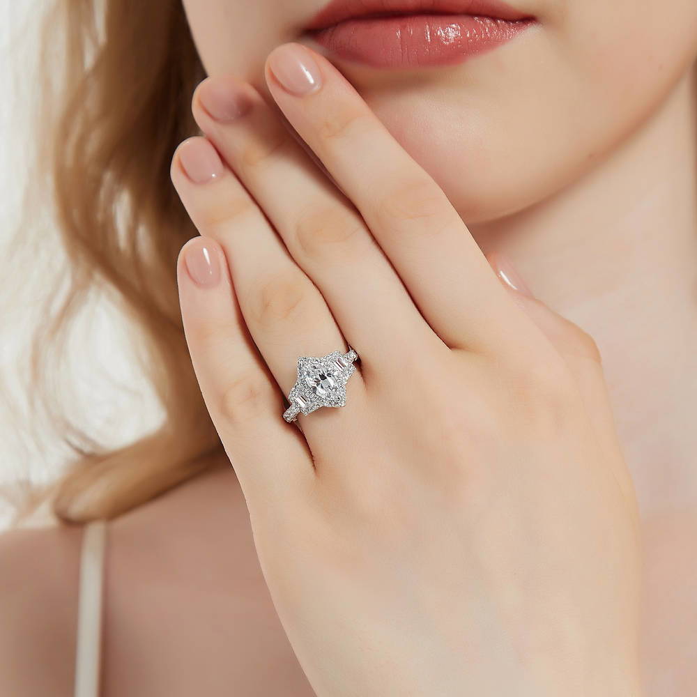 Model wearing 3-Stone Halo 1ct Marquise CZ Ring in Sterling Silver, 2 of 11