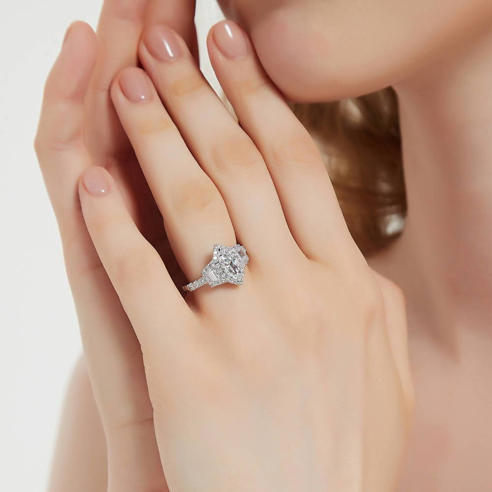 Model wearing 3-Stone Halo 1ct Marquise CZ Ring in Sterling Silver, 3 of 11