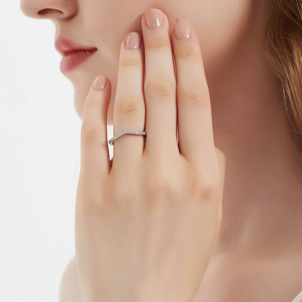 Model wearing 3-Stone Emerald Cut CZ Ring Set in Sterling Silver