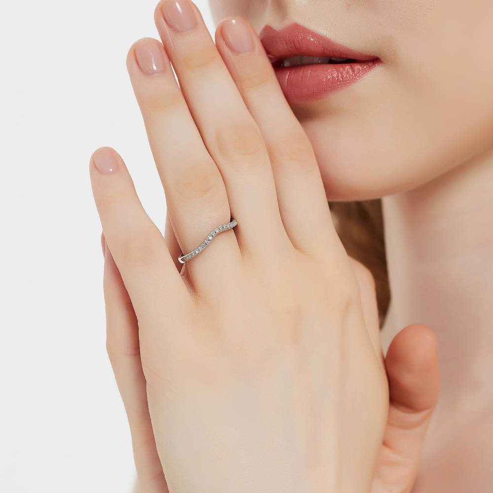 Model wearing 3-Stone Emerald Cut CZ Ring Set in Sterling Silver