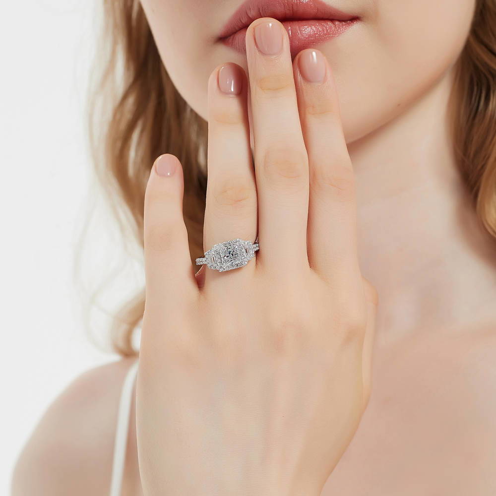 Model wearing Halo 3-Stone 1.2ct Princess CZ Ring in Sterling Silver, 2 of 11
