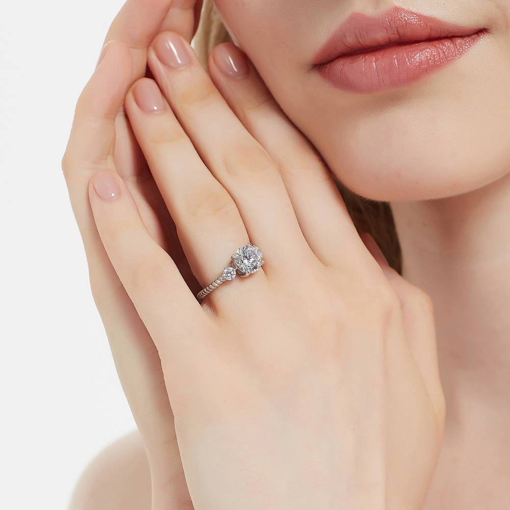 Model wearing 3-Stone Woven 2ct CZ Ring in Sterling Silver, 3 of 10