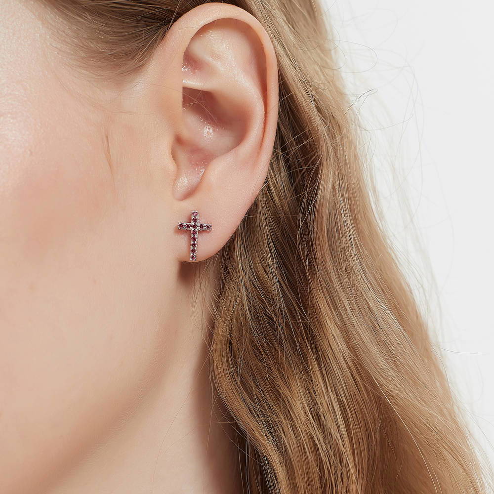 Model wearing Cross CZ Stud Earrings in Sterling Silver, Red Color