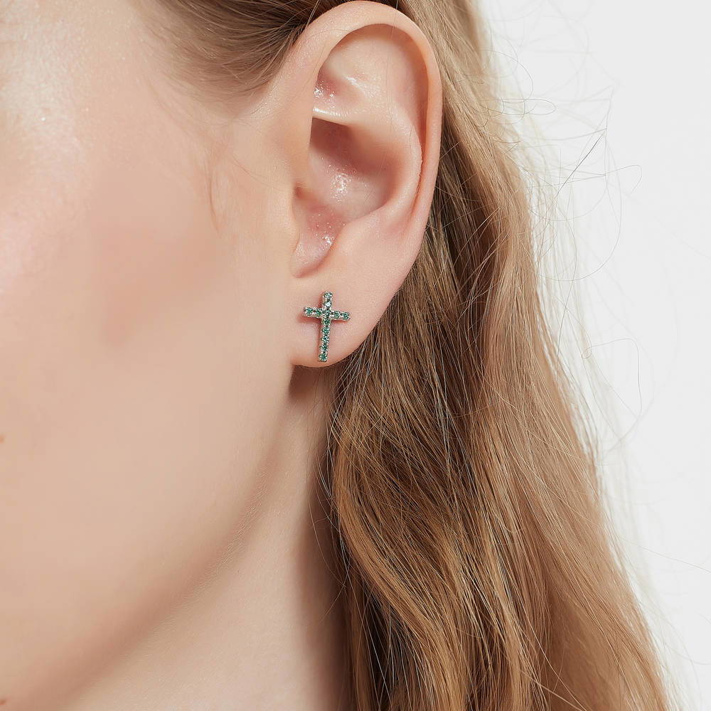 Model wearing Cross CZ Stud Earrings in Sterling Silver, Green Color