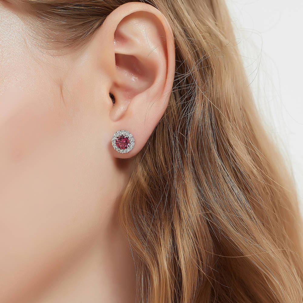 Model wearing Halo Kaleidoscope CZ Stud Earrings in Sterling Silver, Red