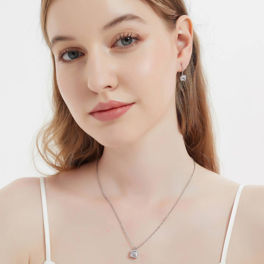 Model wearing Solitaire Asscher CZ Necklace and Earrings Set in Sterling Silver