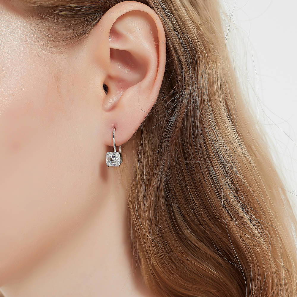 Model wearing Solitaire 3.2ct Asscher CZ Fish Hook Dangle Earrings in Sterling Silver, 2 of 9