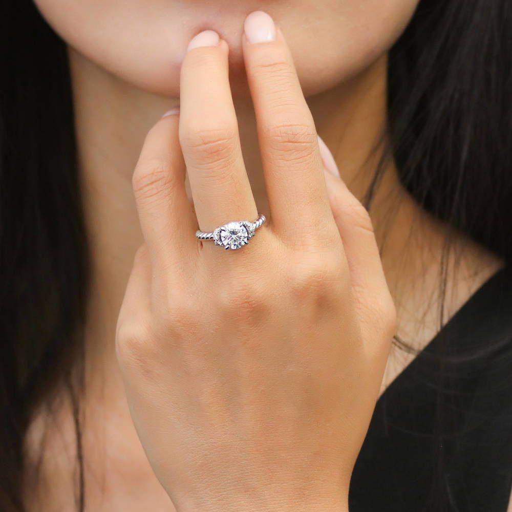 Model wearing Woven Solitaire CZ Ring in Sterling Silver