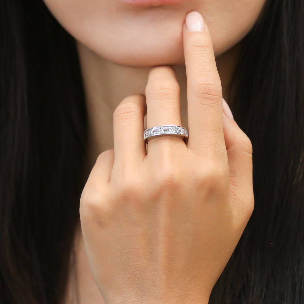 Model wearing 5-Stone Channel Emerald Cut CZ Eternity Ring in Sterling Silver, 2 of 9