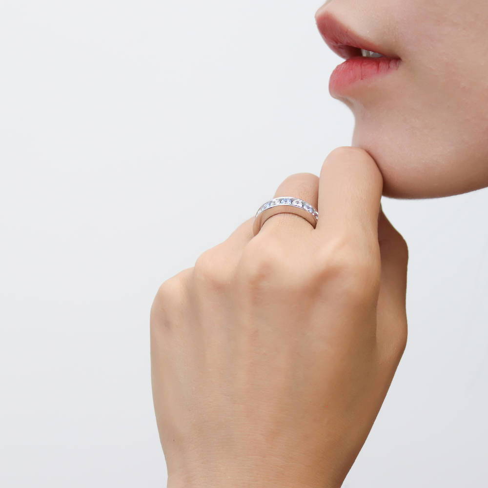 Model wearing Greyish Blue Channel CZ Eternity Ring in Sterling Silver, 6 of 9