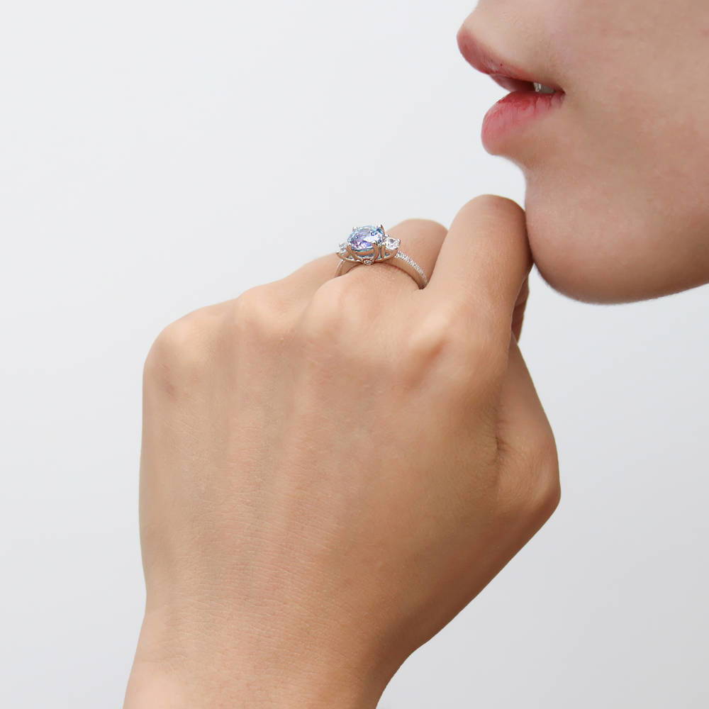 Model wearing 3-Stone Kaleidoscope Purple Aqua CZ Ring in Sterling Silver, 3 of 9