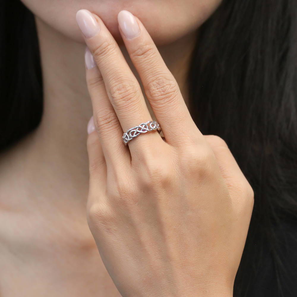 Model wearing Woven Celtic Knot Band in Sterling Silver, 7 of 8