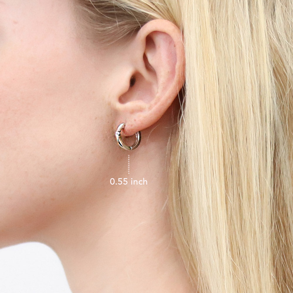 Model wearing Solitaire Round CZ Hoop Earrings in Sterling Silver 0.24ct, 2 Pairs, 6 of 17
