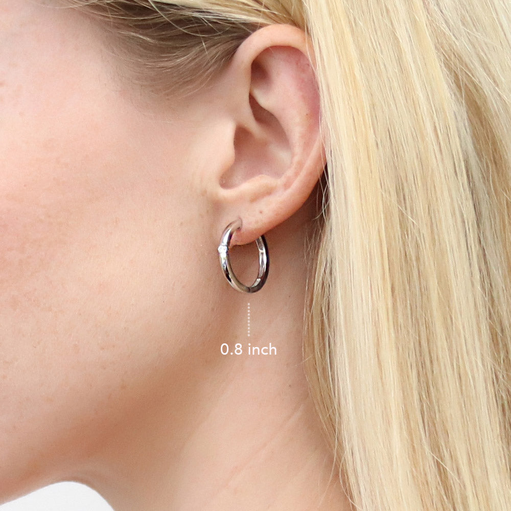 Model wearing Solitaire Round CZ Hoop Earrings in Sterling Silver 0.22ct, 3 Pairs, 9 of 19