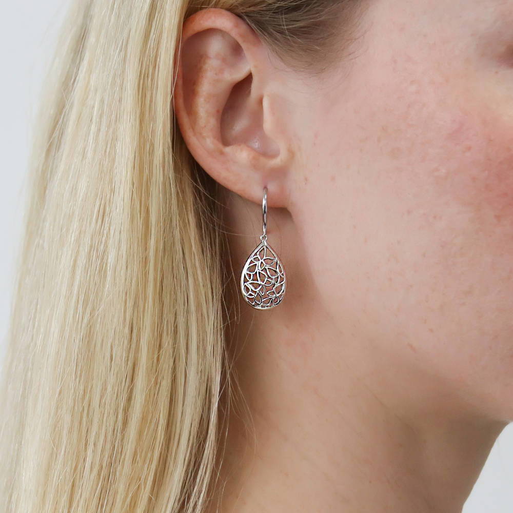 Model wearing Butterfly Teardrop Fish Hook Dangle Earrings in Sterling Silver, 2 of 4