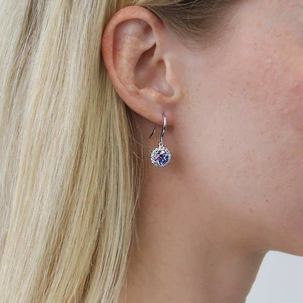 Model wearing Halo Kaleidoscope CZ Fish Hook Earrings in Sterling Silver, Purple Aqua Color