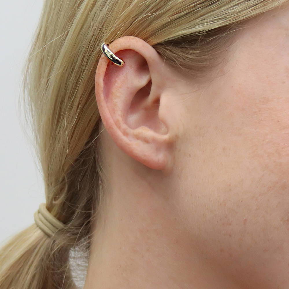 Model wearing Ear Cuffs in Sterling Silver, Yellow Gold Flashed