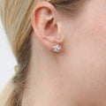 Model wearing Flower CZ Stud Earrings in Sterling Silver, Yellow Gold Flashed
