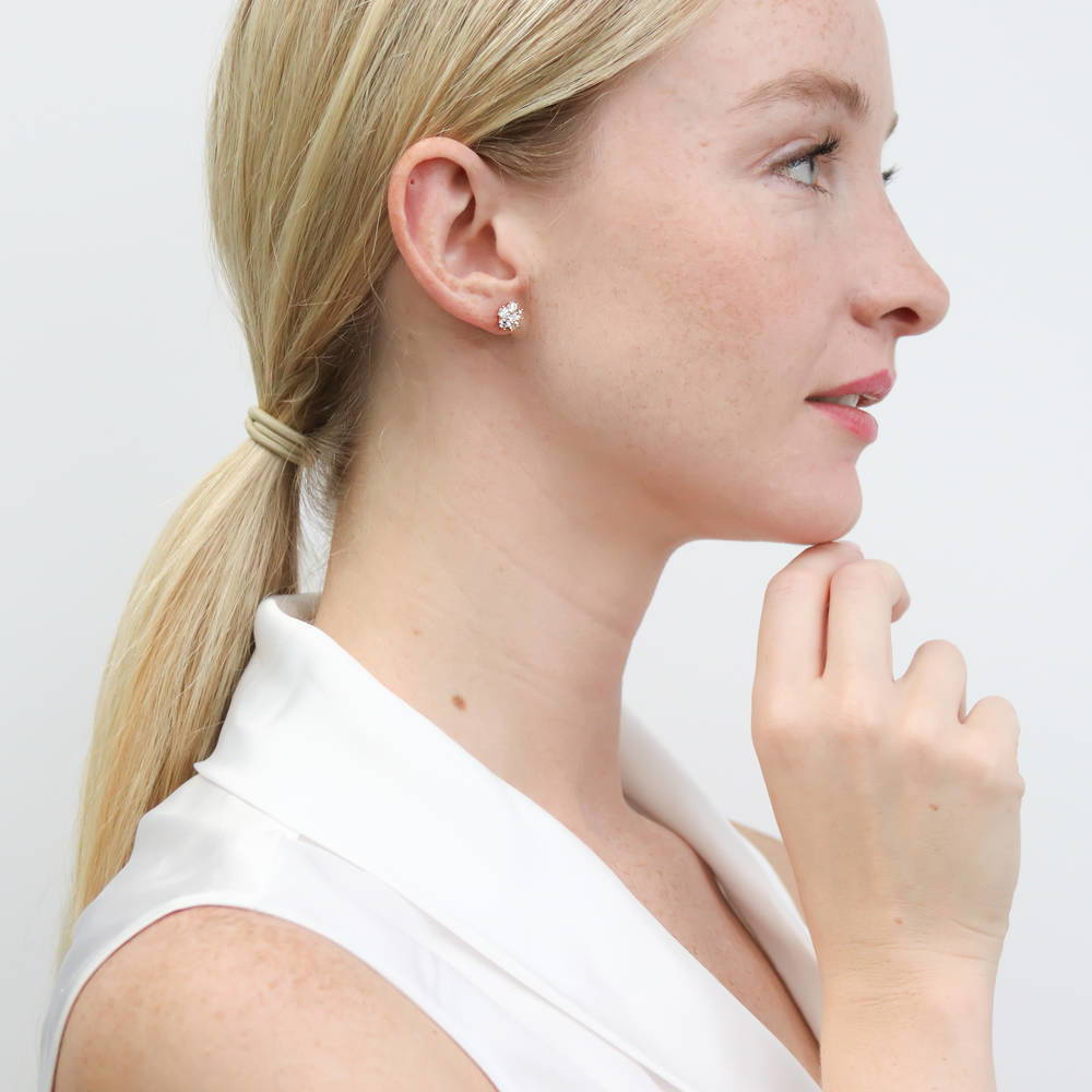 Model wearing Flower CZ Stud Earrings in Sterling Silver, 3 of 13