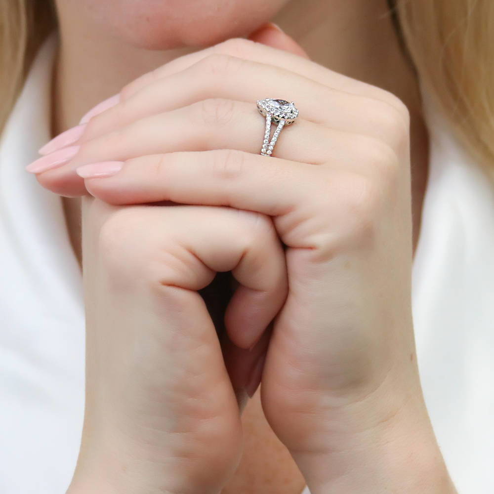 Model wearing Halo Pear CZ Split Shank Ring Set in Sterling Silver