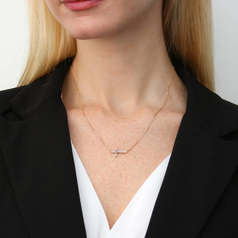 Model wearing Sideways Cross CZ Pendant Necklace in Gold Flashed Sterling Silver, 2 of 6