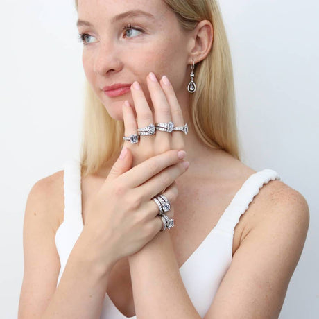 Image Contain: Model Wearing Curved Half Eternity Ring, Solitaire with Side Stones Ring, Teardrop Dangle Earrings
