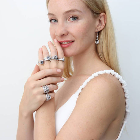 Image Contain: Model Wearing Curved Half Eternity Ring, Solitaire with Side Stones Ring, Teardrop Dangle Earrings