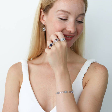 Model Wearing 3-Stone Ring, Art Deco Chain Bracelet, Art Deco Dangle Earrings