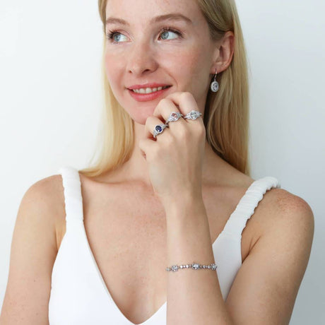 Model Wearing 3-Stone Ring, Art Deco Chain Bracelet, Art Deco Dangle Earrings