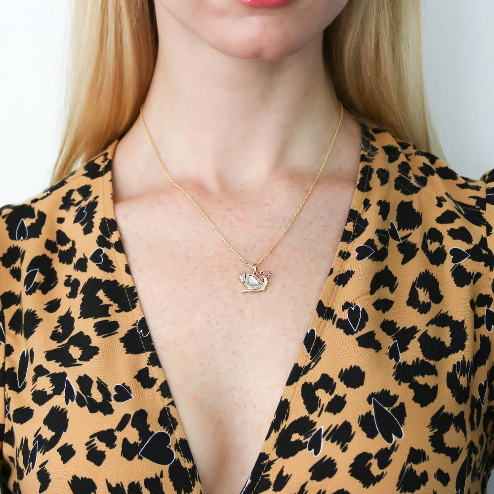 Model wearing Snail Mother Of Pearl Pendant Necklace in Gold Flashed Sterling Silver, 2 of 5