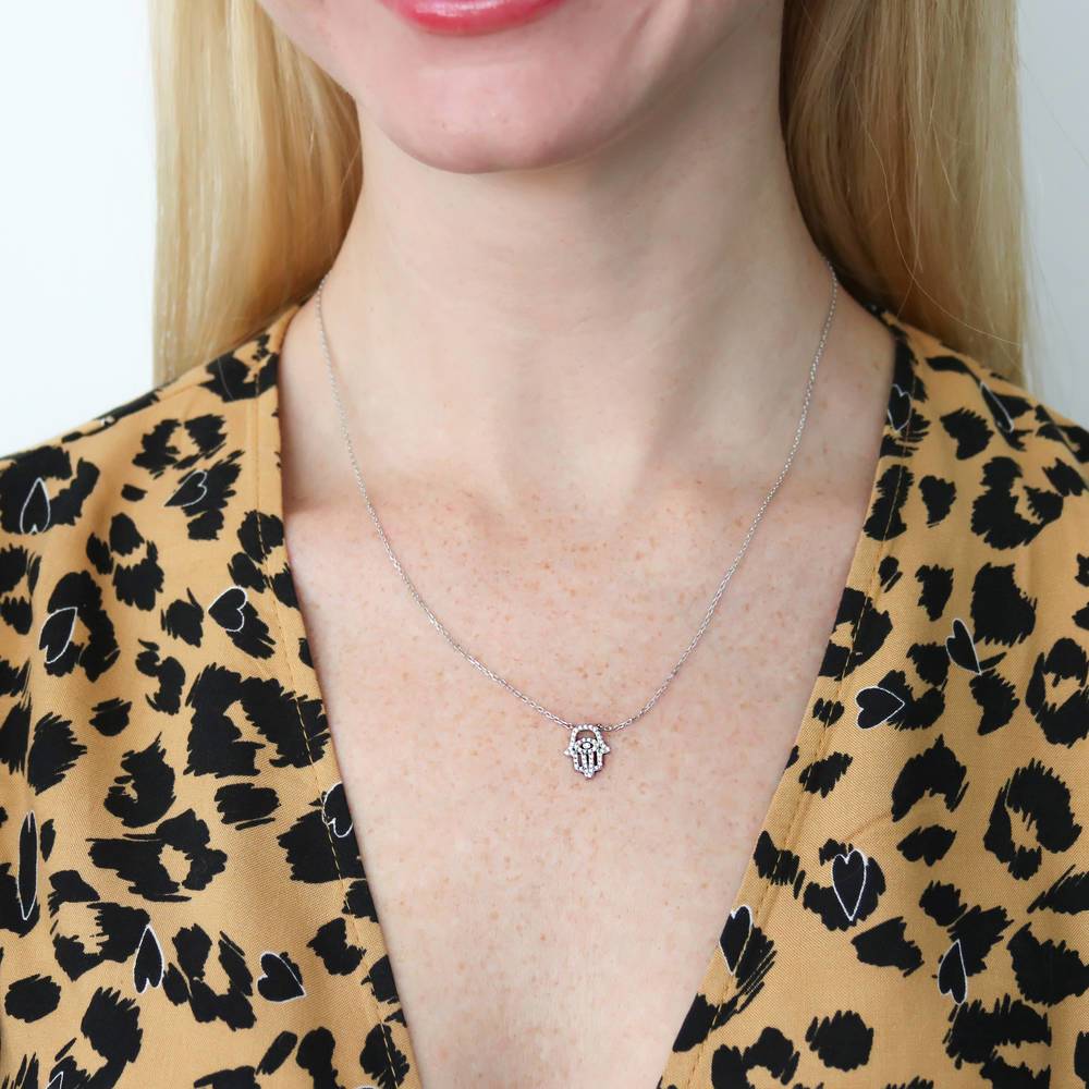 Model wearing Hamsa Hand Evil Eye CZ Pendant Necklace in Sterling Silver, 2 of 5