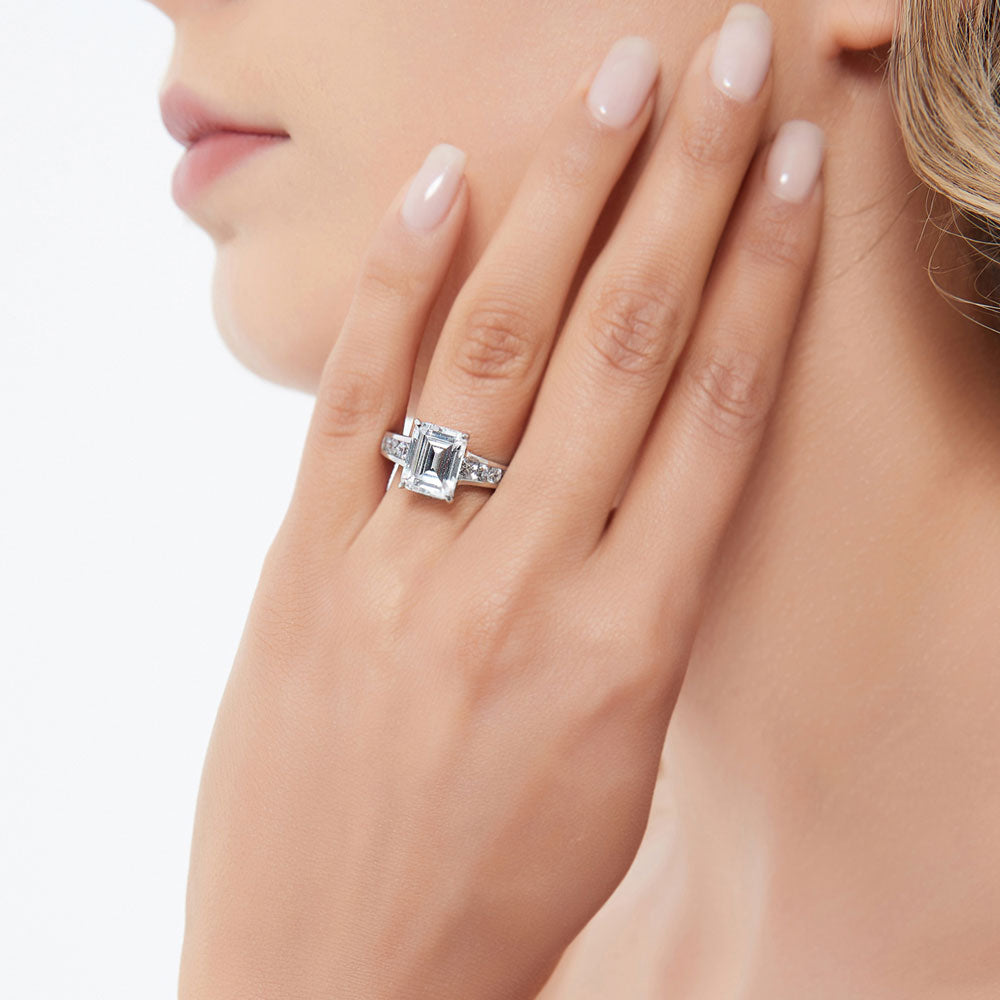 Model wearing Solitaire 3.8ct Emerald Cut CZ Ring in Sterling Silver, 3 of 9