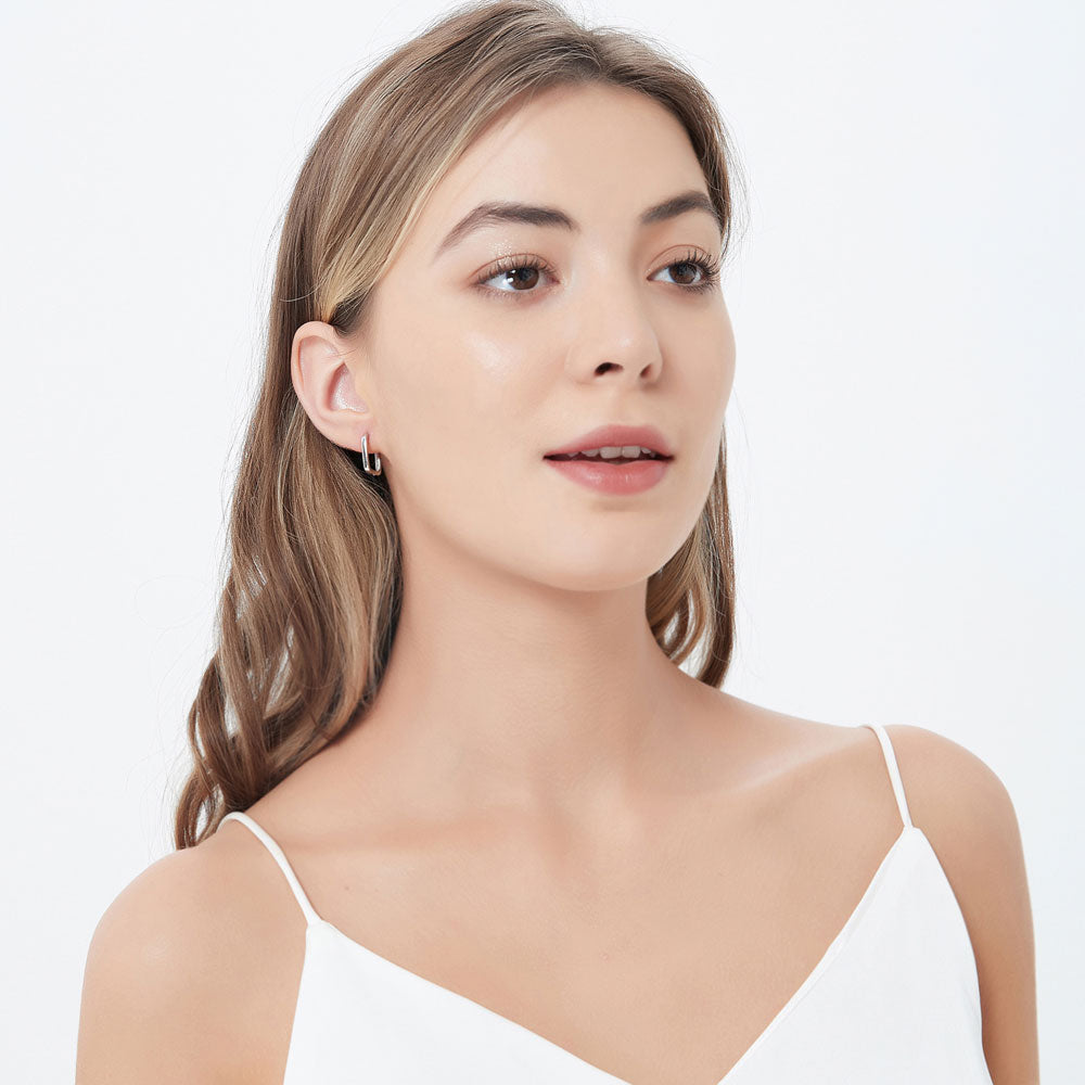 Model wearing Rectangle Small Hoop Earrings in Sterling Silver 0.6 inch, 3 of 8