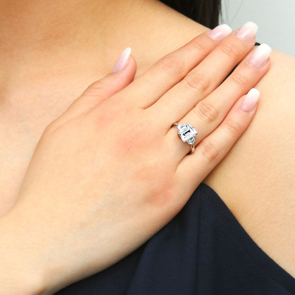 Model wearing 3-Stone Step Emerald Cut CZ Ring in Sterling Silver, 5 of 10