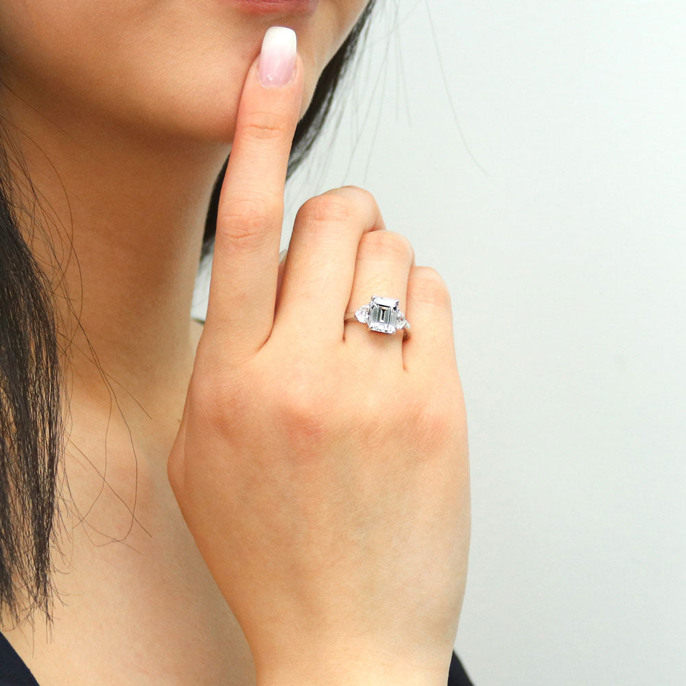 Model wearing 3-Stone 2.6ct Emerald Cut CZ Ring in Sterling Silver, 2 of 11