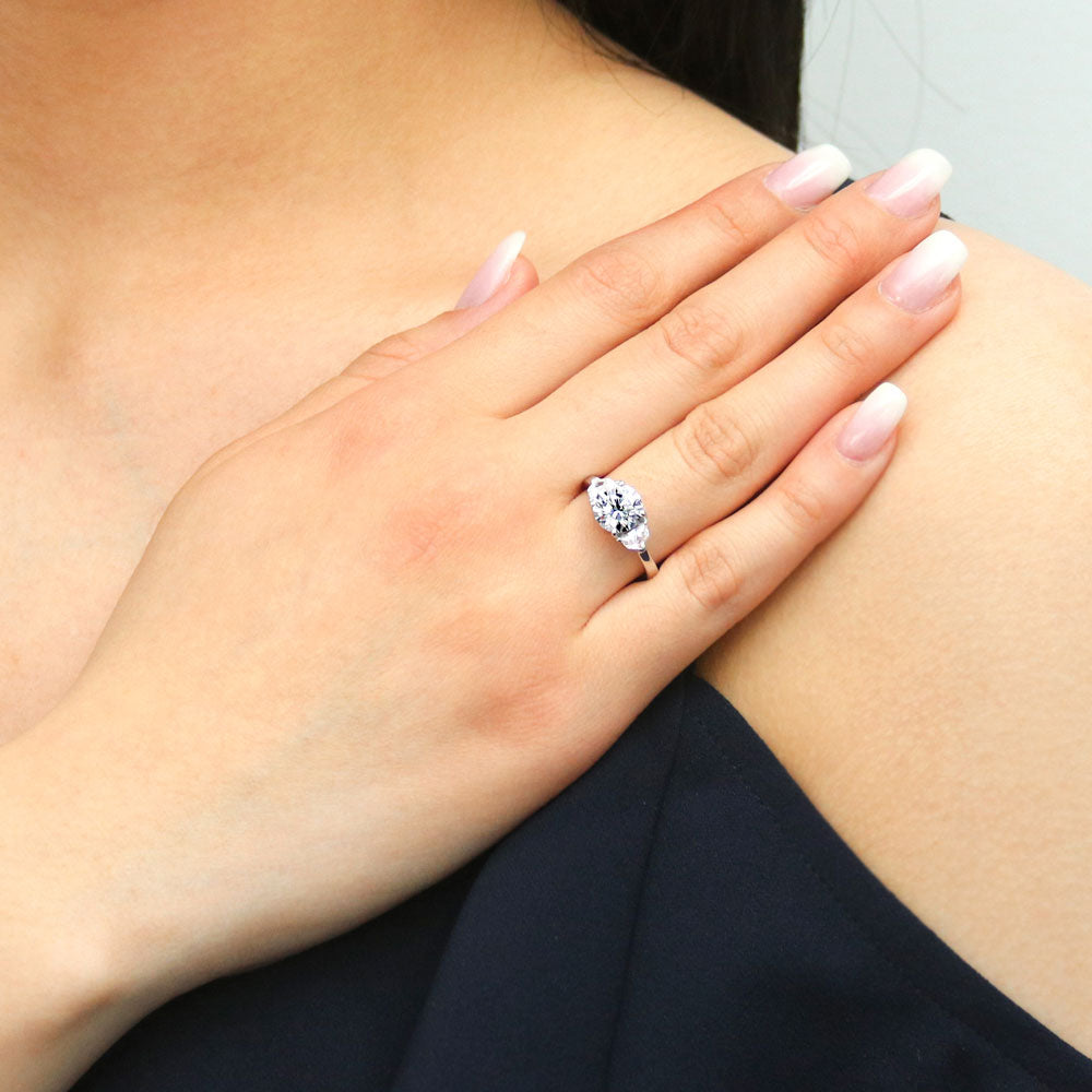 Model wearing 3-Stone Round CZ Ring in Sterling Silver, 3 of 9