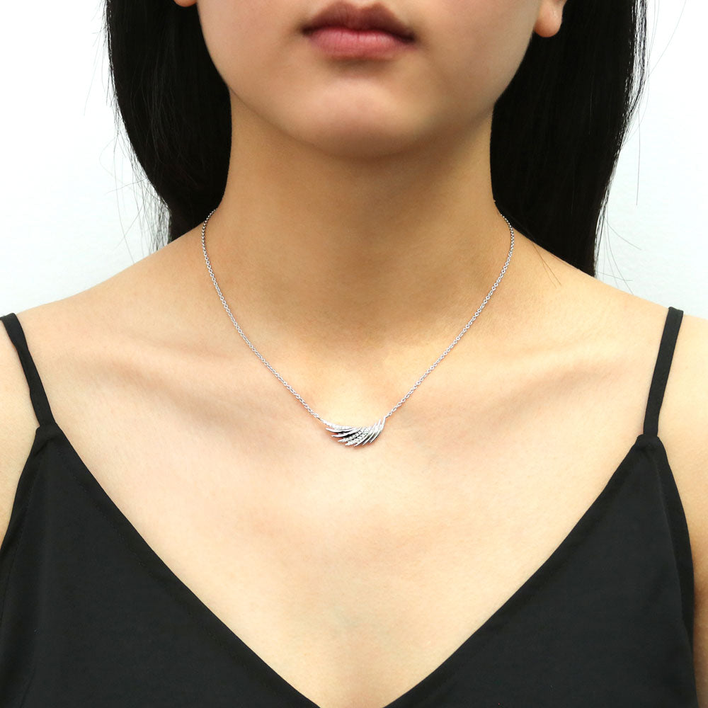 Model wearing Angel Wings CZ Pendant Necklace in Sterling Silver, 2 of 5