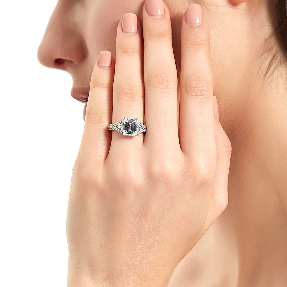 Model wearing 3-Stone 2.6ct Emerald Cut CZ Split Shank Ring in Sterling Silver, 2 of 9