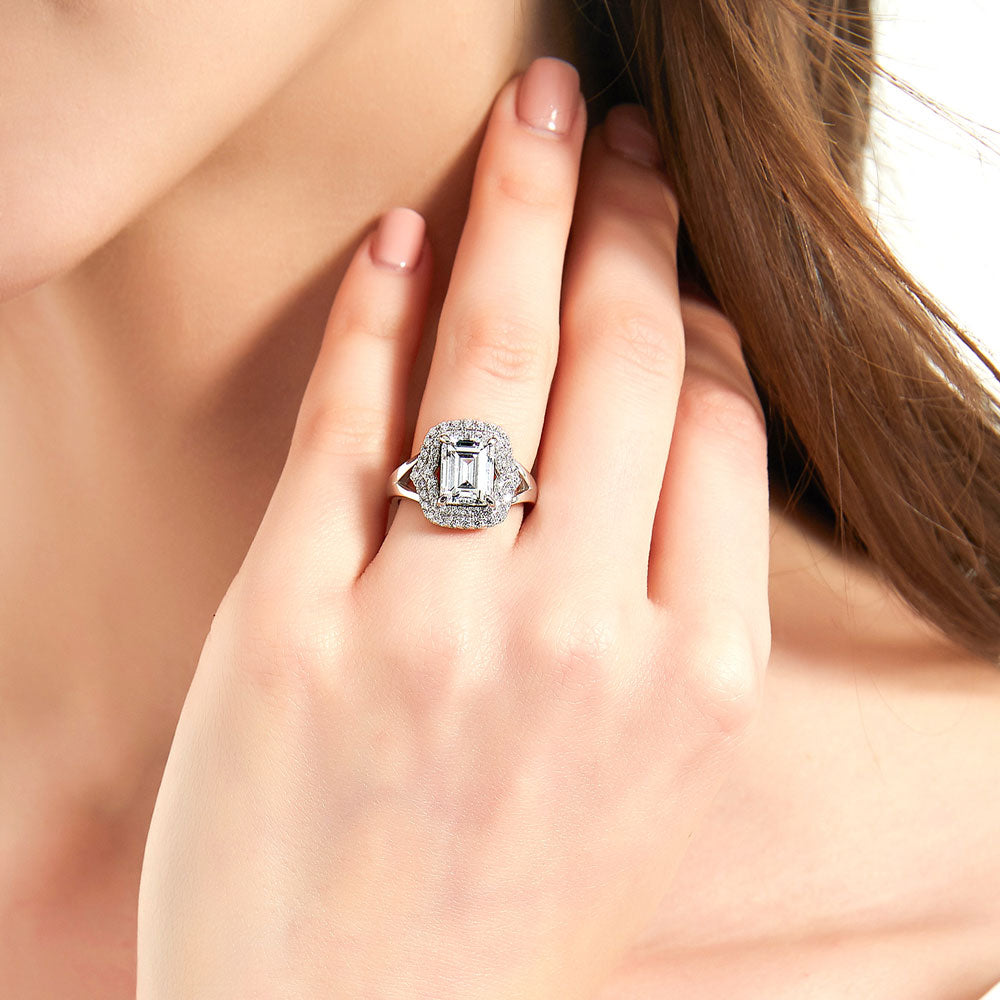 Model wearing Halo Step Emerald Cut CZ Statement Split Shank Ring in Sterling Silver, 2 of 9