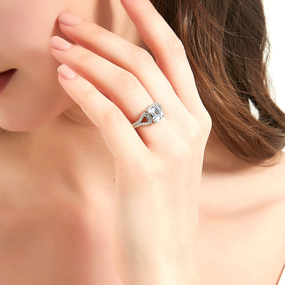 Model wearing Solitaire Emerald Cut CZ Split Shank Ring in Sterling Silver, 6 of 9