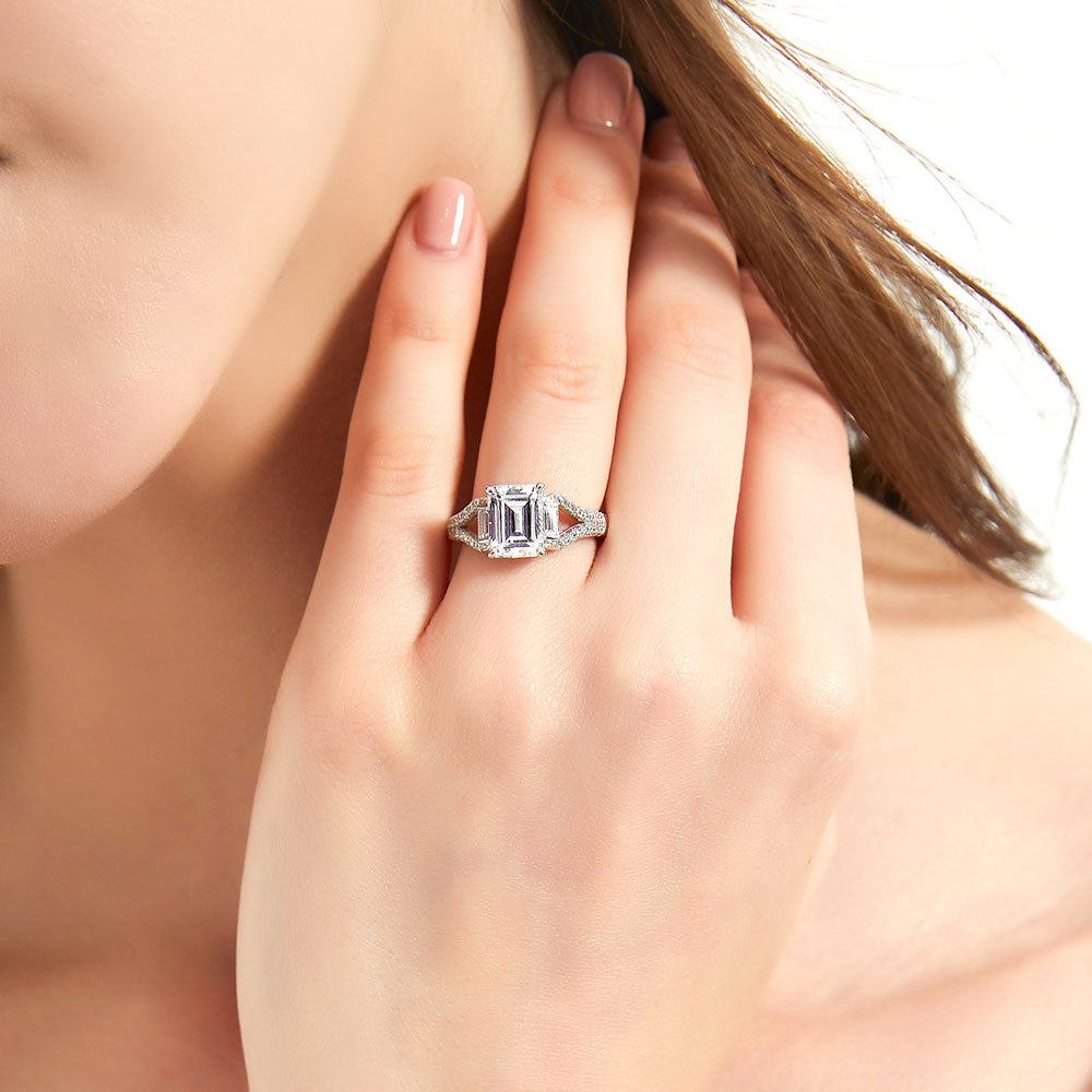 Model wearing Solitaire 2.6ct Step Emerald Cut CZ Split Shank Ring in Sterling Silver, 2 of 9