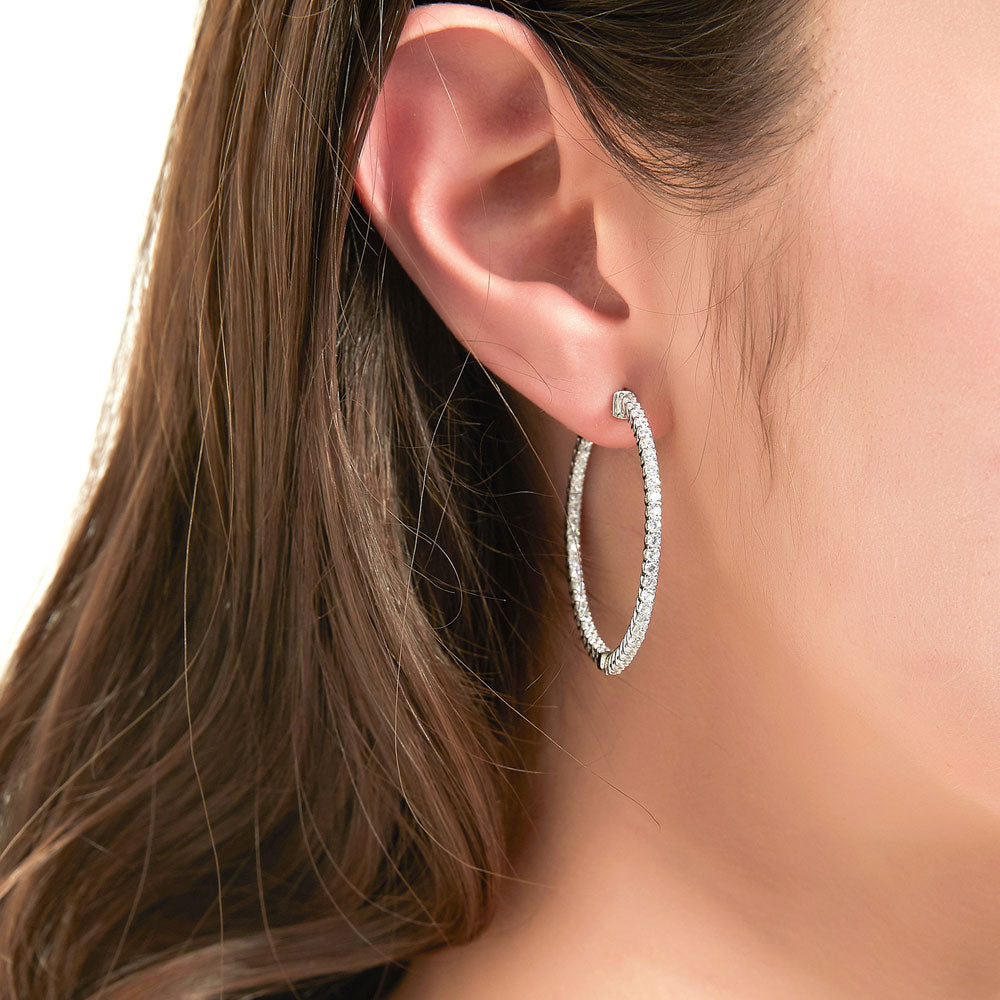 Model wearing CZ Medium Inside-Out Hoop Earrings in Sterling Silver 1.4 inch, 7 of 15