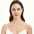 Model wearing Small Hoop Earrings in Sterling Silver 0.6 inch, Yellow Gold Flashed