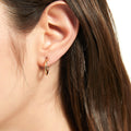 Model wearing Small Hoop Earrings in Sterling Silver 0.6 inch, Yellow Gold Flashed