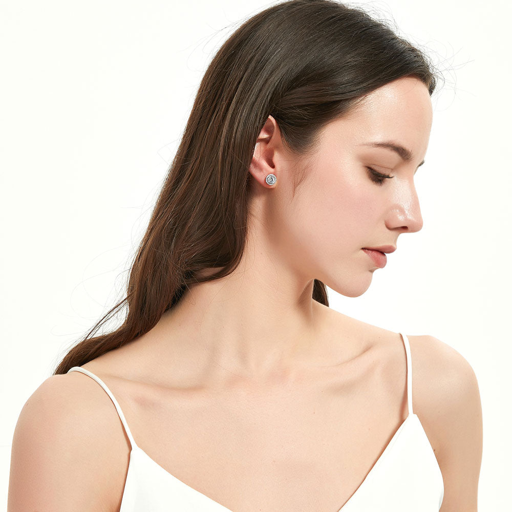 Model wearing Halo Solitaire Round CZ Stud Earrings in Sterling Silver, 2 Pairs, 10 of 19