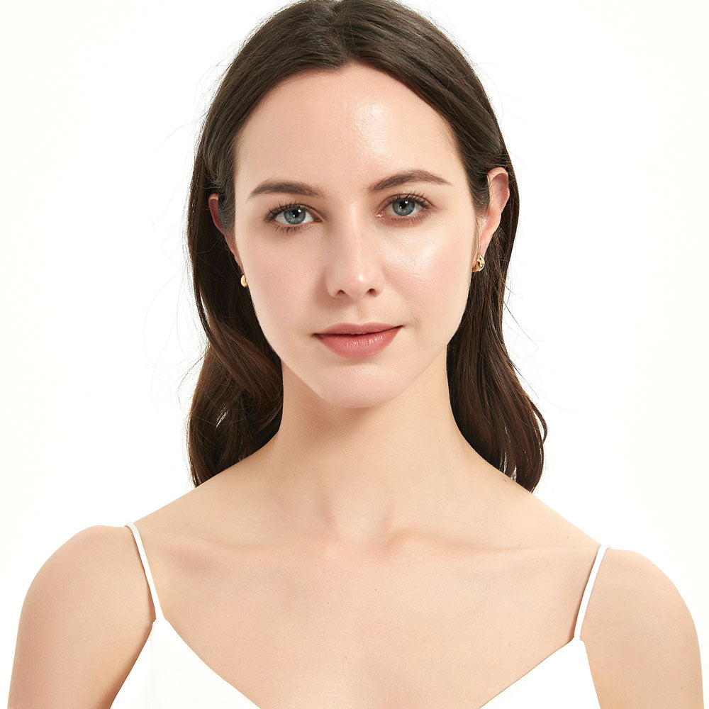 Model wearing Dome Huggie Earrings in Gold Flashed Sterling Silver, 2 Pairs, 6 of 15