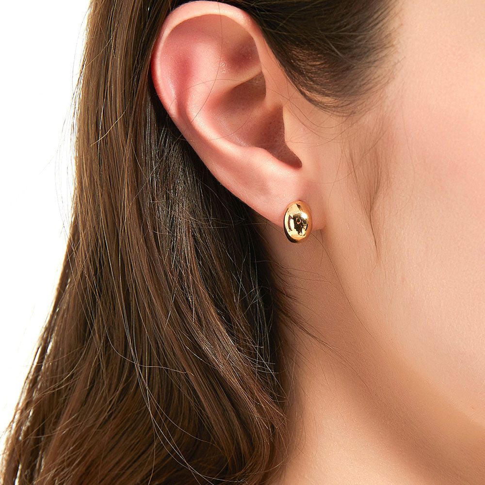 Model wearing Dome Huggie Earrings in Gold Flashed Sterling Silver, 2 Pairs, 2 of 15