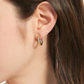 Model wearing Oval Bar CZ Small Hoop Earrings in Sterling Silver 0.7 inch, Yellow Gold Flashed