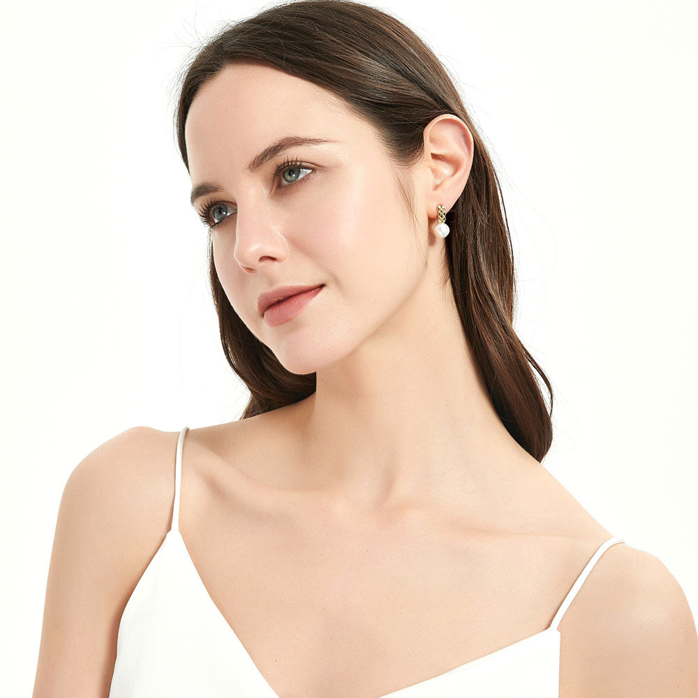 Model wearing Solitaire Irregular Cultured Pearl Stud Earrings in Sterling Silver, 2 of 6
